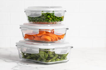 vegetables in glass containers for storage, healthy lifestyle, carrots, peas