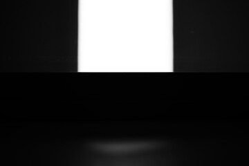 Black and white background of square of light with copy space.