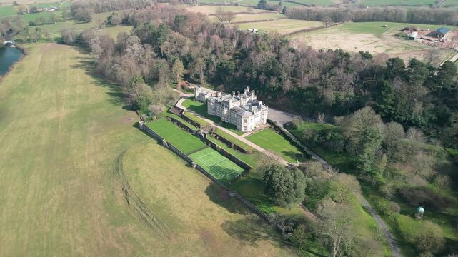 Famous Bolesworth Castle anti-clockwise rotate in spring sunshine, revealing river - Cheshire, England, UK