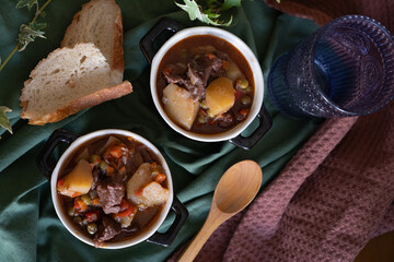 homemade recipe for meat casserole with potatoes and peas with bread. homemade bottom