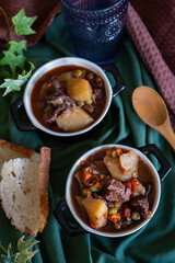 homemade recipe for meat casserole with potatoes and peas with bread. homemade bottom