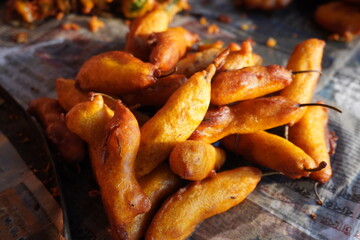 Mirchi Bajji, a popular Indian snack made from chili peppers that are battered and deep-fried
