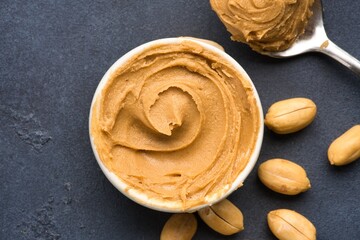  Delicious and healthy peanut butter on black background