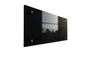 Obraz premium blank black glass sign plate on textured wall isolated on white background