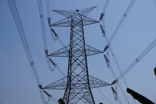 400kV quad transmission line tower which towers support conductors carrying electrical power, typically made of steel, and are designed to withstand high voltages and wind speeds