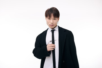 Handsome young asian man showcases effortless style and charisma in elegant attire