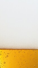 Refreshing glass of amber beer with frothy foam and bubbles on white background