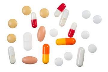 Various capsules and tablets spread out on a white surface highlighting different shapes and colors