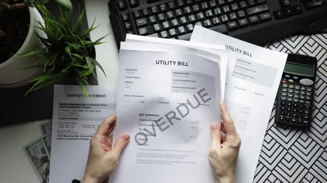 Hands with utility bills top view, tax and penalties reminder, economy and household expenses