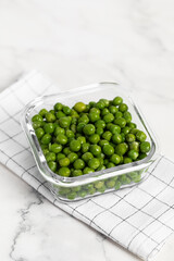 green peas in glass container for storage and cooking, healthy lifestyle, vegetable protein, potassium, fibervvv