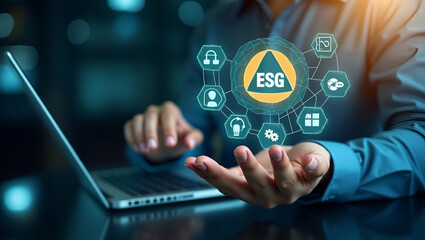 Flat Businessman hand using a laptop with ESG icon on screen display taking into account modern technologies and environmental safety. ESG environment social governance investment business concept. co