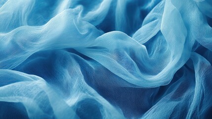 Obraz premium Draped light blue sheer fabric texture.