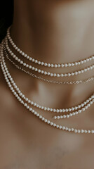 Layered pearl necklaces on a mannequin's neck against a dark background; perfect for jewelry website or fashion magazine
