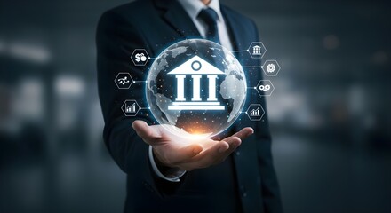 A businessman holds a glowing globe with a bank symbol, representing finance and digital banking in a modern, tech-driven environment.