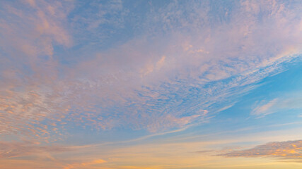 Aerial view A breathtaking view of a coastal city at sunset, with golden hues illuminating the sky...