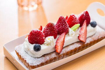 Homemade strawberry cake with creamy frosting.