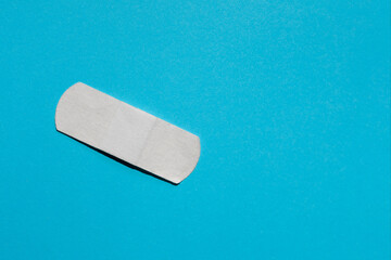 pharmacy medicament white band-aid on blue background