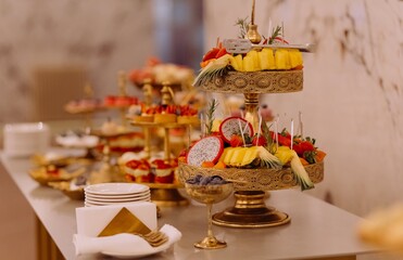 Elegant Fruit and Dessert Display at a Stylish Event