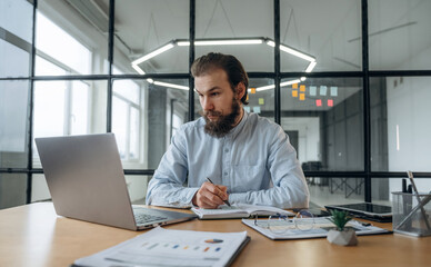 Focused at work. Businessman is in the office