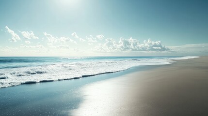 Obraz premium Scenic empty beach with sunlight, ocean edge, and space for ads