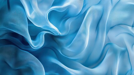 Obraz premium Delicate blue fabric with soft flowing folds and gentle waves
