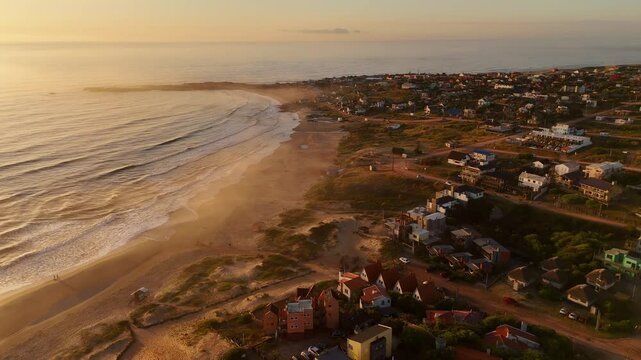 Punta del Diablo town beach at sunrise, Rocha, Uruguay. Aerial drone panoramic view