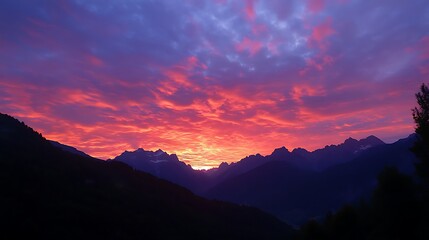 Fototapeta premium a sunset over a snowy mountain