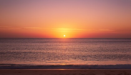 Tranquil minimalist beach sunset scene as the sun dips below the horizon, leaving behind a soft, beautiful gradient of orange and pink in the sky
