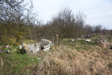 Abandoned garbage, industrial waste, threatening the natural environment.
