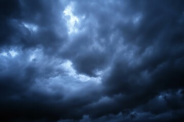 Obraz premium Black dark blue gray sky with heavy clouds. Dramatic background. Storm hurricane wind rain cloudy. Ominous scary creepy.