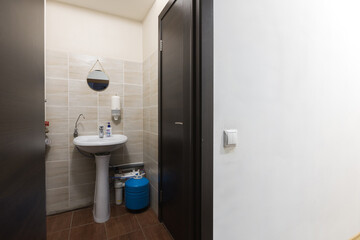 modern bathroom room with toilet and washing machine