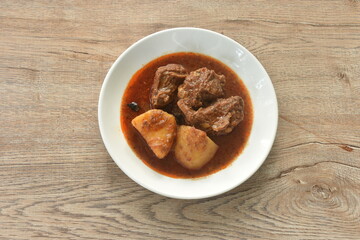 beef curry or Mussamun Indian food with slice potato on plate 