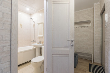 modern bathroom room with toilet and washing machine