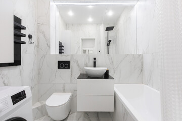 modern bathroom room with toilet and washing machine