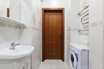 modern bathroom room with toilet and washing machine