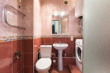 modern bathroom room with toilet and washing machine