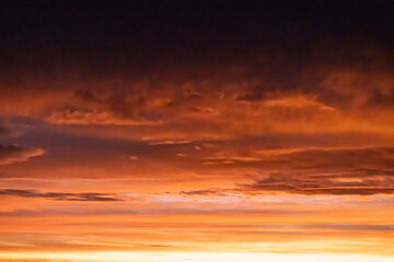 Vibrant sunrise sky with red and orange clouds