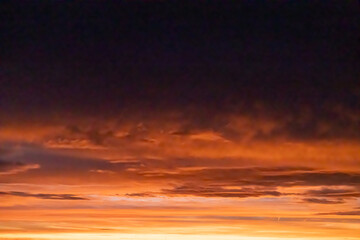 Vibrant sunrise sky with red and orange clouds