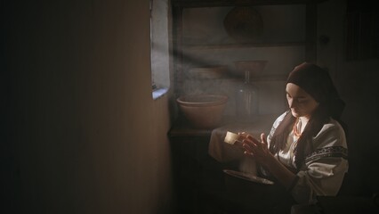 A Woman Engaged in Traditional Craftwork Exudes Skill and Passion in Soft Natural Light