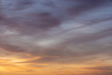 soft blue sky with yellow clouds at dawn