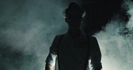 A Mysterious Silhouette Appears in Smoke, Wearing a Hat That Adds to Its Intriguing Presence