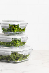green peas in glass container for storage and cooking, healthy lifestyle, vegetable protein,...