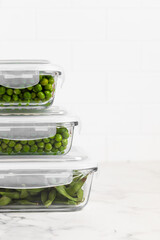 green peas in glass container for storage and cooking, healthy lifestyle, vegetable protein,...