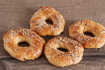 Quick Bagels on Wooden background, top view. Jewish sweet bread