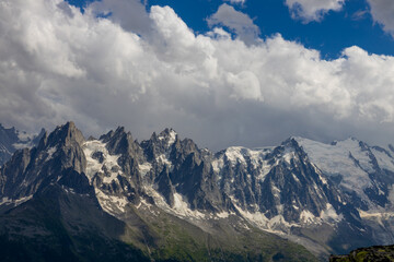 Aiguilles de Chamonix rocky granite mountain peaks in french Alps around Mont Blanc summit in Chamonix valley. Scenic landscape of iconic alpine summits the legends of mountaineering and alpinism