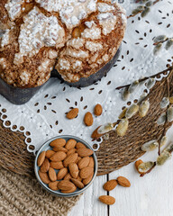 Fototapeta premium Colomba - Italian traditional Easter bread is topped with pearl sugar and almonds in the shape of a dove. Festive pastries are traditional in Italy.