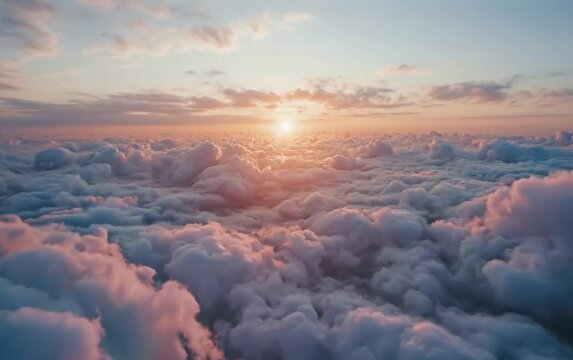 Fluffy clouds under the wing, bathed in the soft light of the rising sun. A view from an airplane window.
