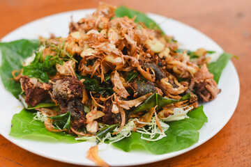 Fried frog with garlic on a plate