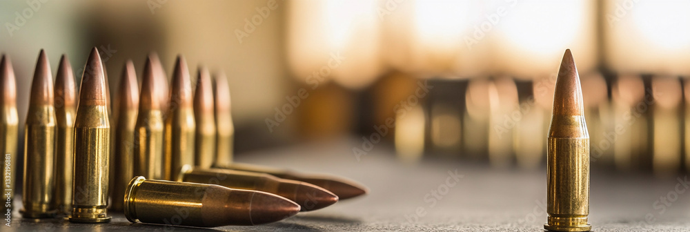 Poster Close-up view of lined up ammunition on a work surface Generative AI