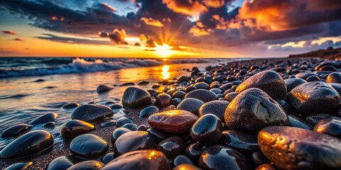 Obraz premium Surreal Sunset Beach: Black Stones & Coastal Rocks Close-Up